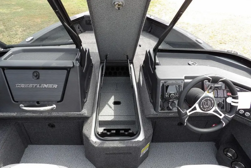 Slide: The Image of 2025 Crestliner 1850 Fish Hawk Tiller interior with steering wheel and storage compartments. - 31