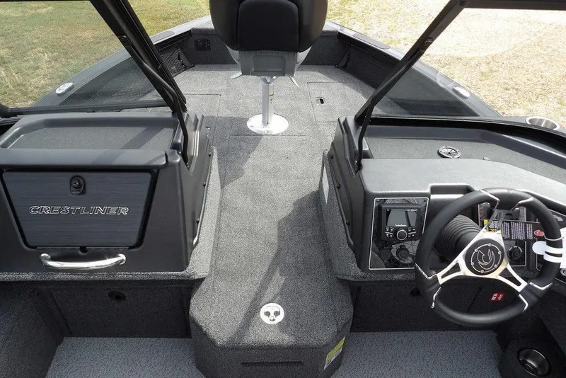 Slide: The Image of 2025 Crestliner 1850 Fish Hawk Tiller interior with steering console and seating. - 32