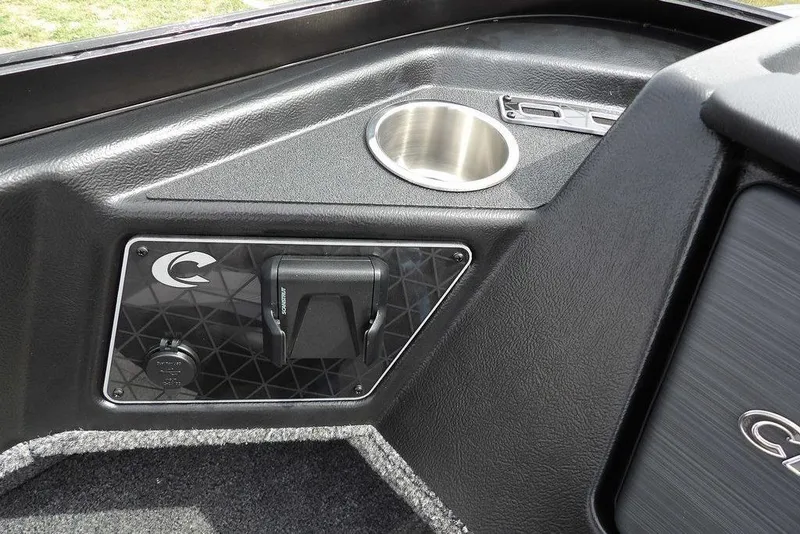 Slide: The Image of 2025 Crestliner 1850 Fish Hawk Tiller dashboard with cup holder and control panel. - 34