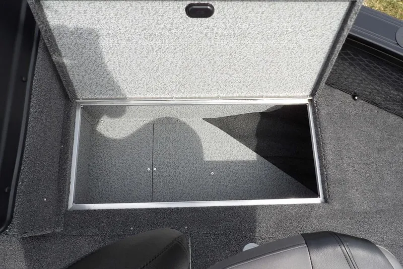 Slide: The Image of Open storage compartment in 2025 Crestliner 1850 Fish Hawk Tiller boat. - 39