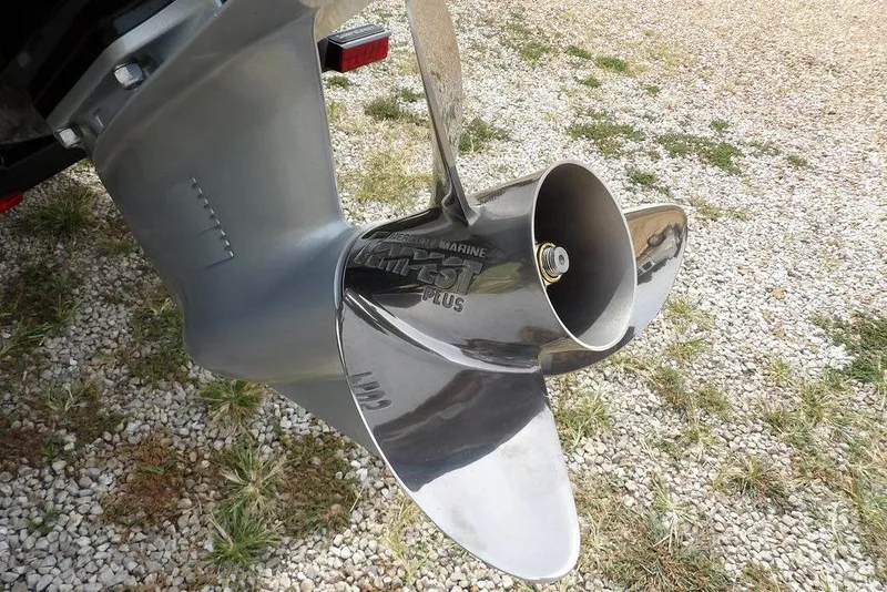Slide: The Image of Propeller of 2025 Crestliner 1850 Fish Hawk Tiller on gravel surface. - 50