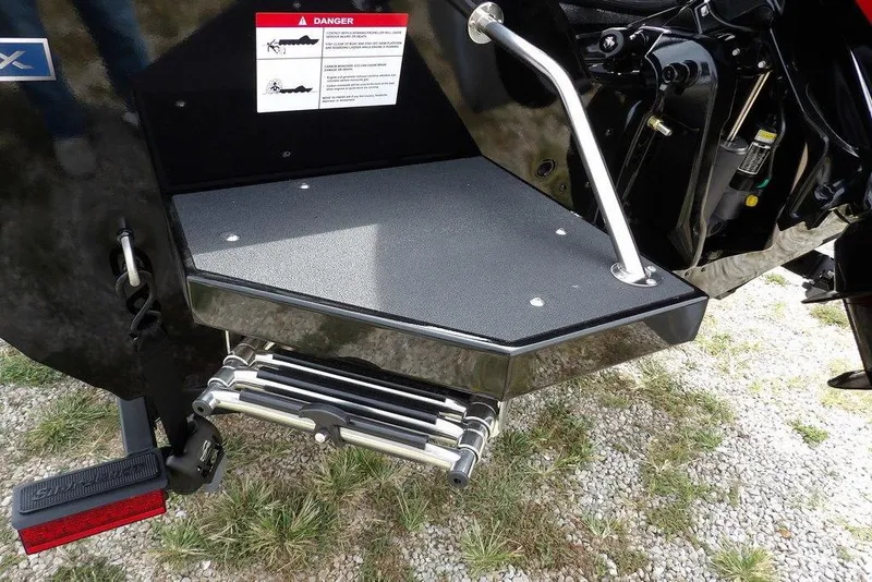 Slide: The Image of 2025 Crestliner 1850 Fish Hawk Tiller boat with swim platform and ladder. - 51