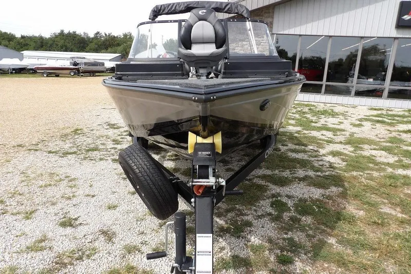 Slide: The Image of 2025 Crestliner 1850 Fish Hawk Tiller boat on trailer, front view. - 55