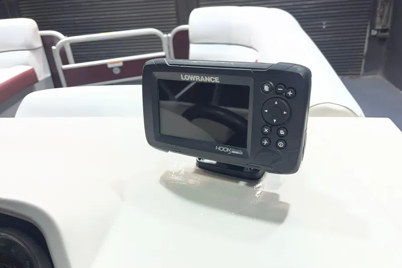 Slide: The Image of Lowrance Hook Reveal fish finder on 2023 Godfrey Sweetwater 2286 C boat dashboard. - 16