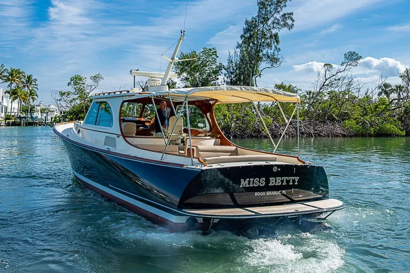 Slide: The Image of 2002 Hinckley Talaria 40 yacht "Miss Betty" cruising in scenic waters. - 18