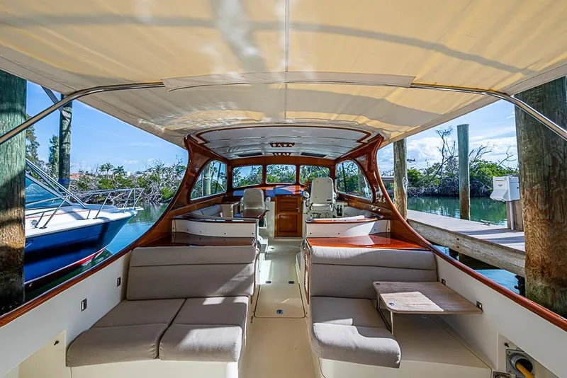 Slide: The Image of Interior view of 2002 Hinckley Talaria 40 yacht with elegant seating and wooden accents. - 3