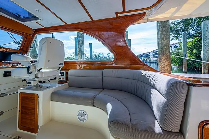 Slide: The Image of Interior of 2002 Hinckley Talaria 40 yacht with plush seating and wooden accents. - 5