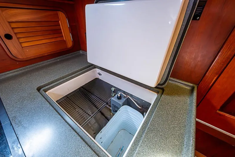 Slide: The Image of Hinckley Talaria 40 yacht interior, 2002 model, featuring an open built-in cooler. - 14