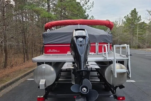 Slide: The Image of 2017 Sun Tracker Party Barge 20 DLX pontoon boat with red canopy and outboard motor. - 4