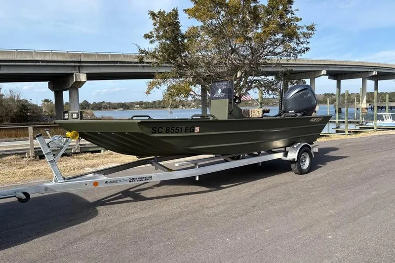 The Image of 2025 Alweld 2070VVCC Bay Boat on trailer near bridge and waterway. - 1