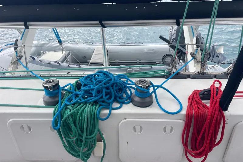 Slide: The Image of Deck of 2004 Lagoon 570 sailboat with colorful ropes and winches. - 20