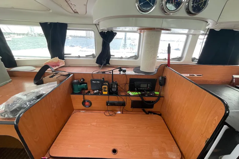 Slide: The Image of Interior of 2004 Lagoon 570 yacht with navigation equipment and ocean view. - 29