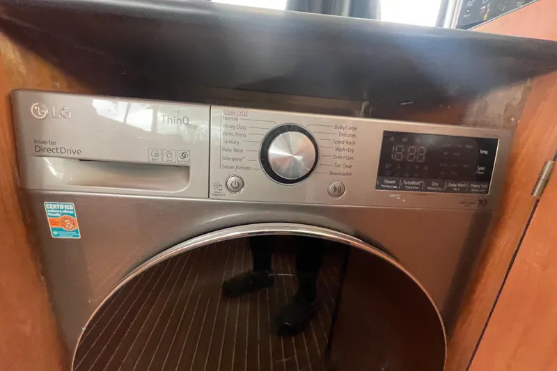 Slide: The Image of LG ThinQ Direct Drive washing machine with digital display and control panel. - 52