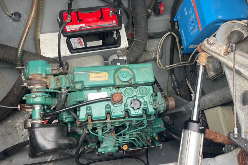 Slide: The Image of Engine compartment of a 2004 Lagoon 570 with Volvo Penta engine and battery. - 61