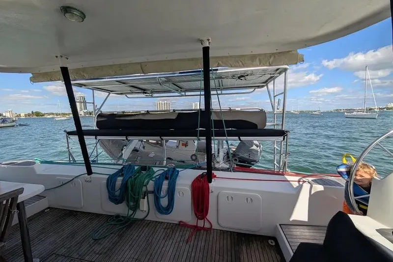 Slide: The Image of Lagoon 570 yacht deck view, 2004 model, with ropes and ocean backdrop. - 65