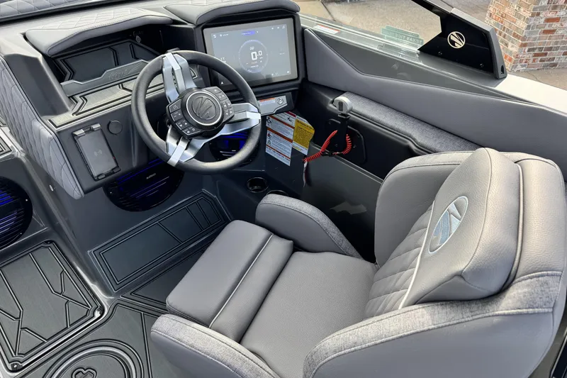 Slide: The Image of 2026 Tigé Z3 boat interior with modern steering wheel and dashboard display. - 12
