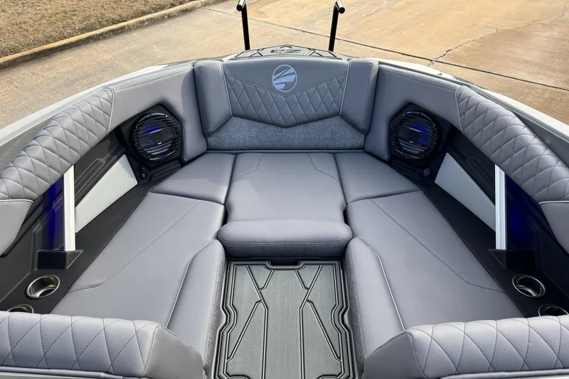 Slide: The Image of 2026 Tigé Z3 boat interior with gray seating and speakers. - 16