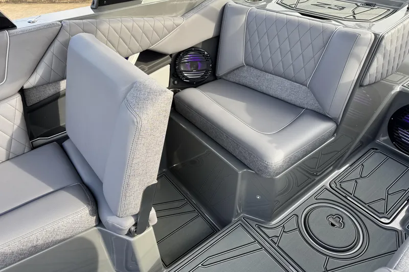 Slide: The Image of 2026 Tigé Z3 boat interior with gray quilted seats and sleek design. - 19