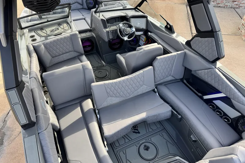 Slide: The Image of 2026 Tigé Z3 boat interior with luxurious gray seating and modern dashboard design. - 20
