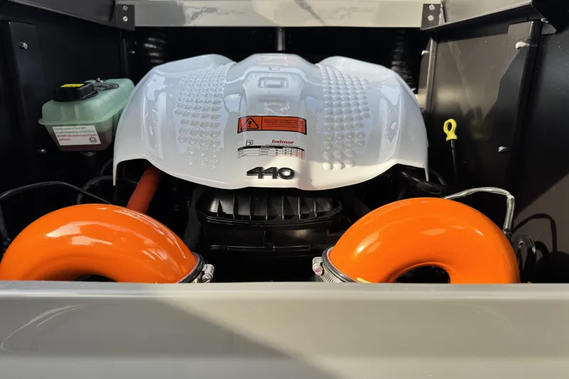 Slide: The Image of Engine compartment of 2026 Tigé Z3 boat with orange components and white cover. - 22