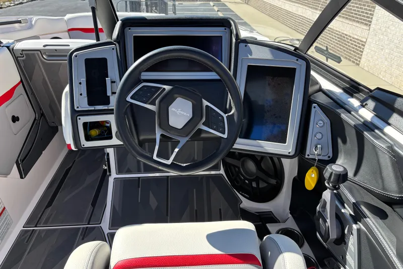 Slide: The Image of 2022 Supra SL 400 boat dashboard with modern steering and digital displays. - 11