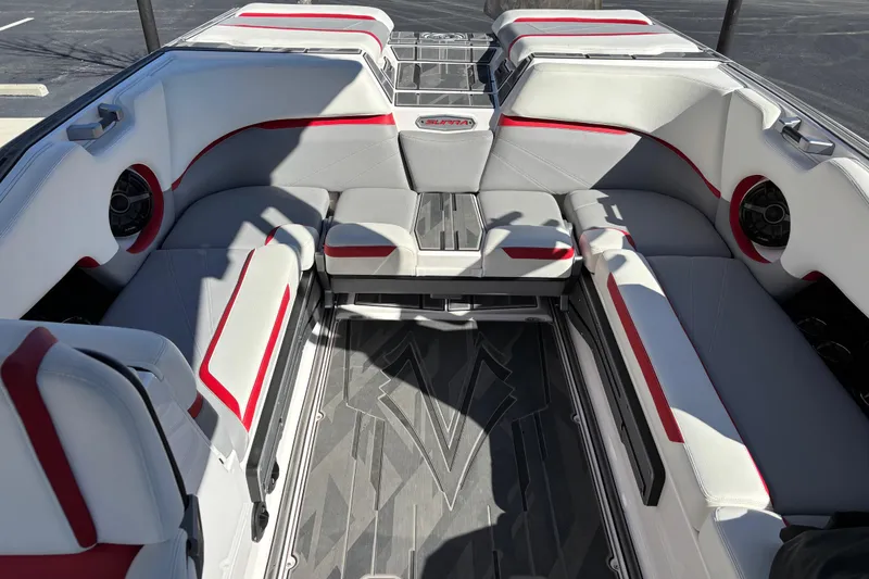 Slide: The Image of 2022 Supra SL 400 boat interior with red and white seating, modern design. - 9
