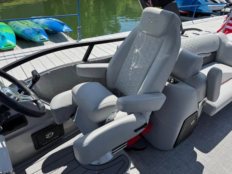 Slide: The Image of Luxurious seating on 2026 JC SportToon 24 TT DSL pontoon boat at dock. - 15