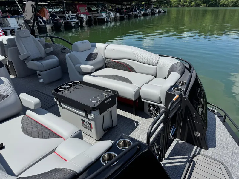 Slide: The Image of Luxurious 2026 JC SportToon 24 TT DSL pontoon boat interior with plush seating and cup holders. - 3