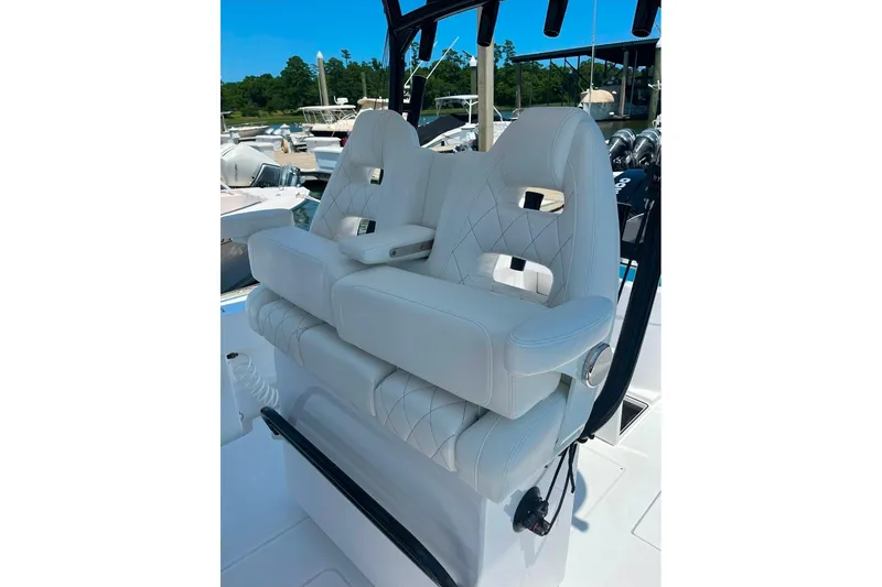 Slide: The Image of Luxurious seating on 2024 Onslow Bay 33 Tournament boat, featuring white leather upholstery. - 5