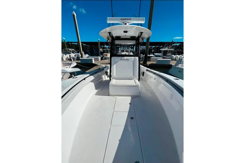 Slide: The Image of 2024 Onslow Bay 33 Tournament boat interior with seating and Garmin equipment. - 6