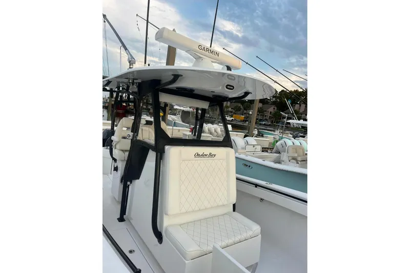 Slide: The Image of 2024 Onslow Bay 33 Tournament boat with Garmin equipment, docked at marina. - 7