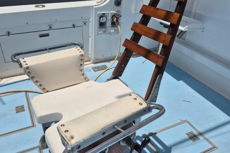 Slide: The Image of Fishing chair and ladder on 1982 Bertram 38 Convertible boat deck. - 7