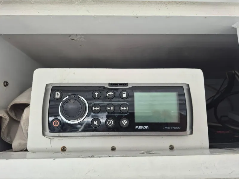 Slide: The Image of Fusion MS-IP600 marine stereo in a 1982 Bertram 38 Convertible boat. - 32