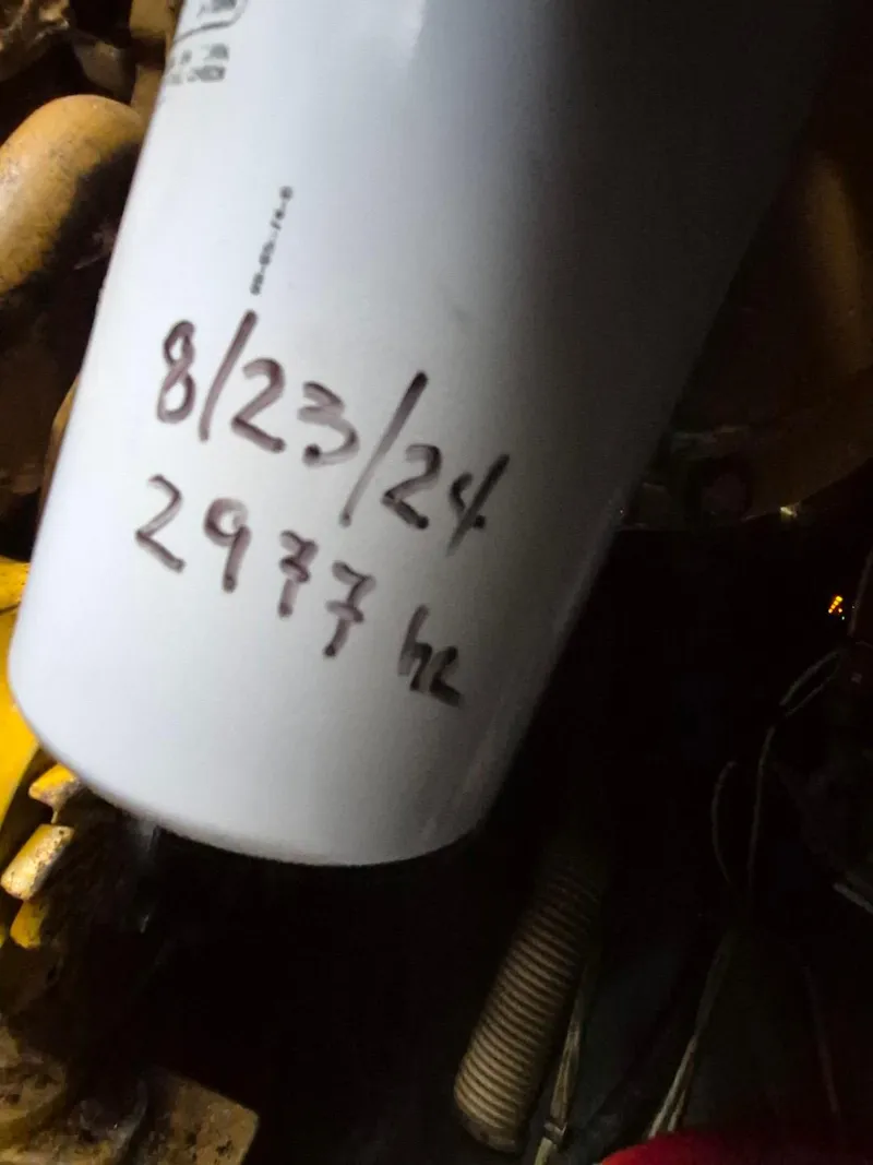Slide: The Image of Oil filter with handwritten date and hours, Bertram 38 Convertible, 1982 model. - 37