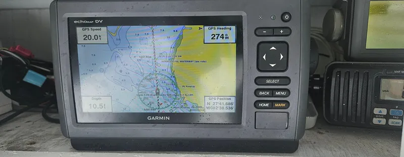Slide: The Image of Garmin GPS device on 1982 Bertram 38 Convertible boat, displaying navigation map. - 4