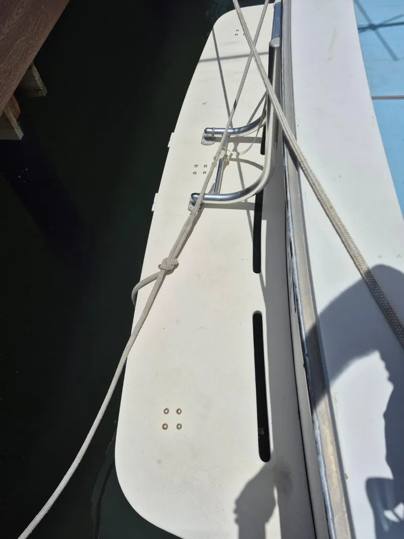 Slide: The Image of 1982 Bertram 38 Convertible boat deck with ropes and cleats. - 11