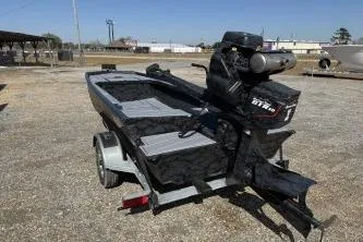 Slide: The Image of 2026 Gator Tail 1854 Extreme boat on trailer, outdoor setting. - 4