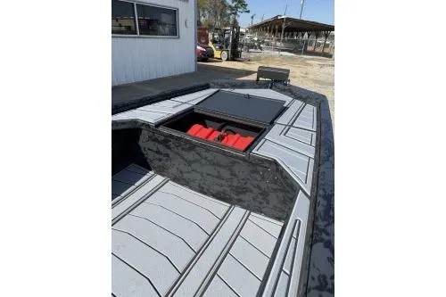 Slide: The Image of 2026 Gator Tail 1854 Extreme boat with open storage compartment, gray deck, and red interior. - 6