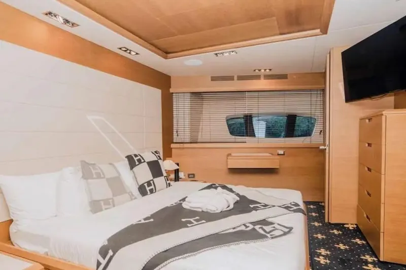 Slide: The Image of Luxurious bedroom interior on 2010 Azimut 100 Leonardo yacht, featuring modern design and cozy bedding. - 10