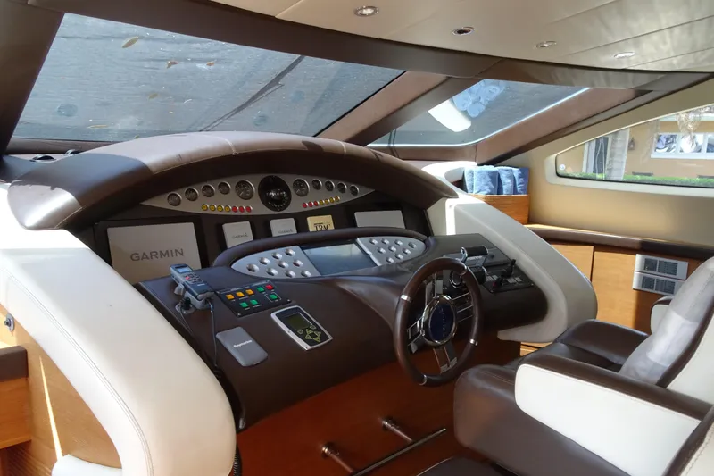 Slide: The Image of Luxurious interior of 2010 Azimut 100 Leonardo yacht with modern dining area and waterfront view. - 22