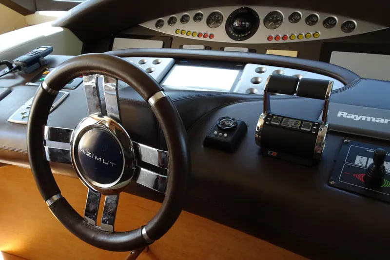 Slide: The Image of Luxurious interior of 2010 Azimut 100 Leonardo yacht with elegant seating and dining area. - 27