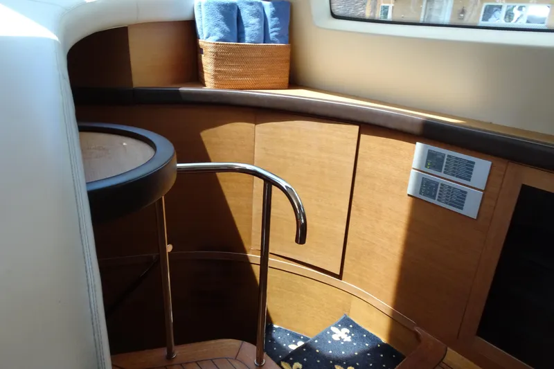 Slide: The Image of Luxurious helm station of 2010 Azimut 100 Leonardo yacht with leather seating and wooden accents. - 28