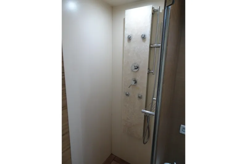 Slide: The Image of Cockpit of 2010 Azimut 100 Leonardo yacht with steering wheel and control panel. - 34