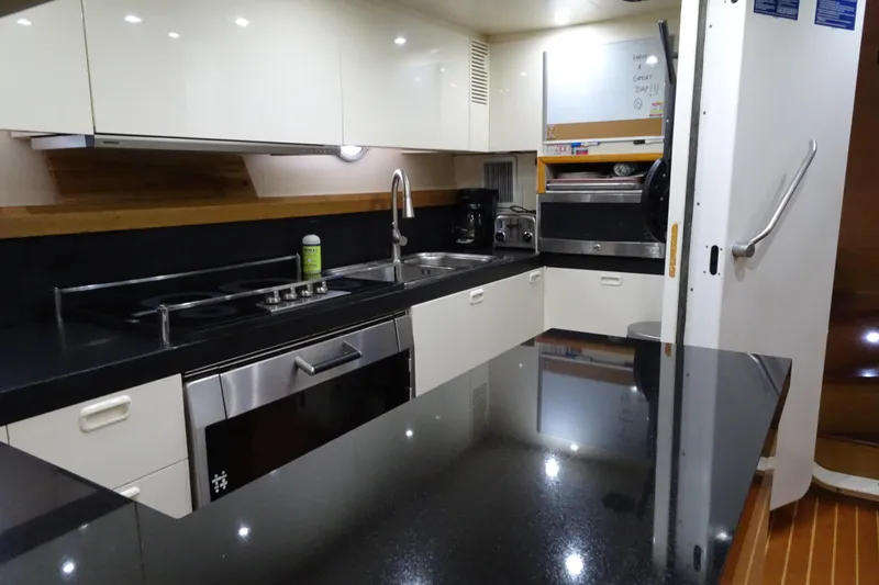 Slide: The Image of Modern kitchen in 2010 Azimut 100 Leonardo yacht with sleek appliances and black countertops. - 55