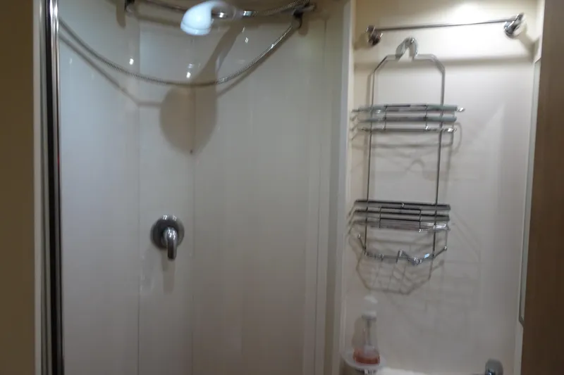 Slide: The Image of Bunk beds in 2010 Azimut 100 Leonardo yacht cabin, featuring cozy bedding and wooden interior. - 59