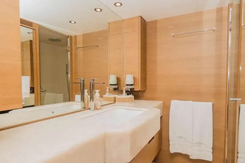 Slide: The Image of Luxurious bedroom interior on 2010 Azimut 100 Leonardo yacht, featuring elegant wood finishes. - 8