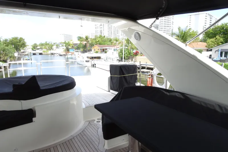 Slide: The Image of Luxury seating area on 2010 Azimut 100 Leonardo yacht with sleek black covers. - 83