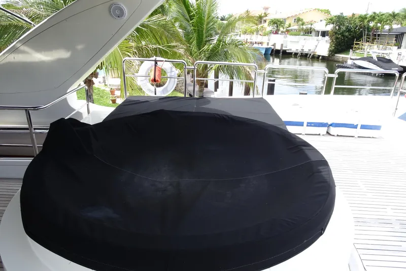 Slide: The Image of Deck view of 2010 Azimut 100 Leonardo yacht with wooden flooring and safety equipment. - 87