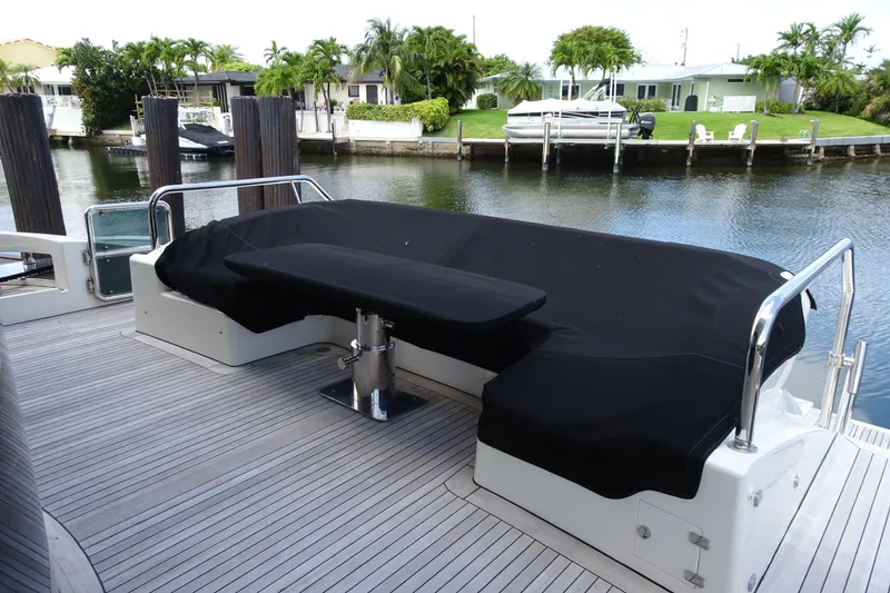 Slide: The Image of Side view of 2010 Azimut 100 Leonardo yacht docked by a canal. - 90