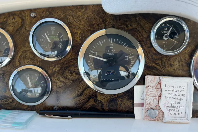 Slide: The Image of 1997 Sea Ray 420 Aft Cabin dashboard with gauges and inspirational quote plaque. - 18